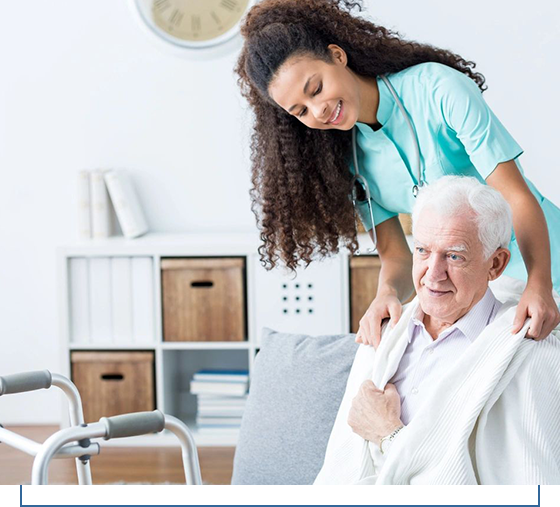 A woman helping an older man to get up