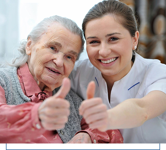 A woman and an old lady giving thumbs up.