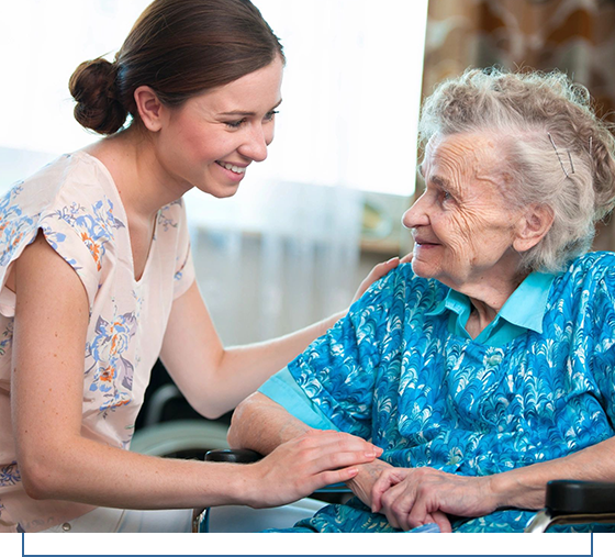 A woman holding hands with an older person.